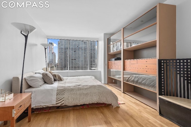 bedroom with light hardwood / wood-style flooring