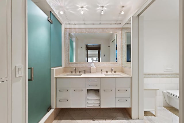 bathroom with tile patterned floors, tile walls, toilet, and vanity