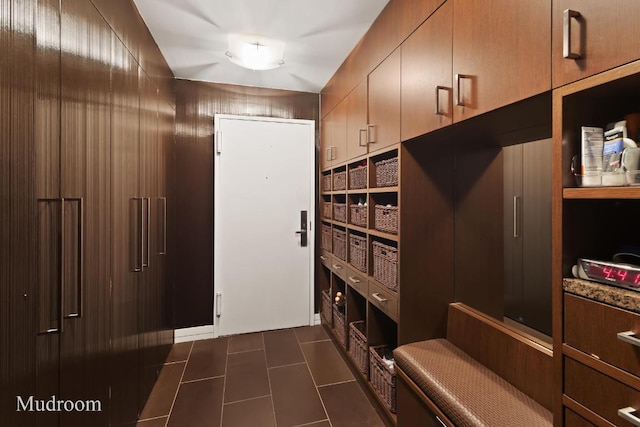 mudroom featuring dark tile patterned flooring