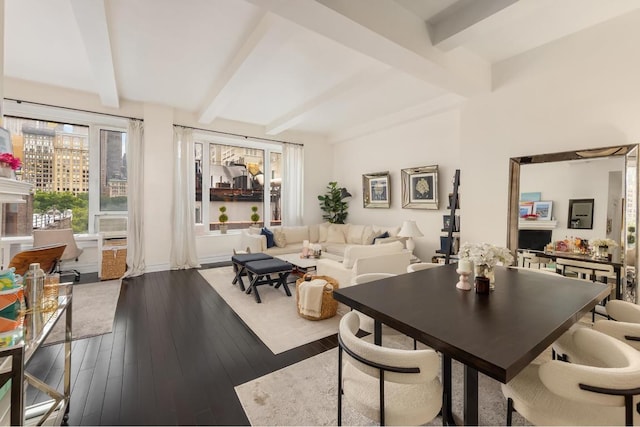 dining room featuring hardwood / wood-style flooring and beamed ceiling