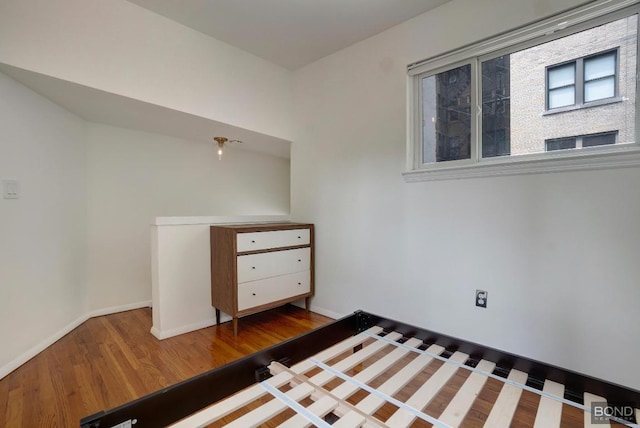 unfurnished bedroom with hardwood / wood-style floors