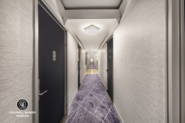 hall featuring dark tile patterned floors