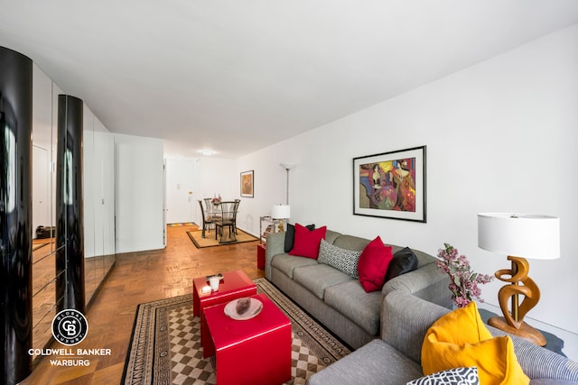 living room featuring parquet floors