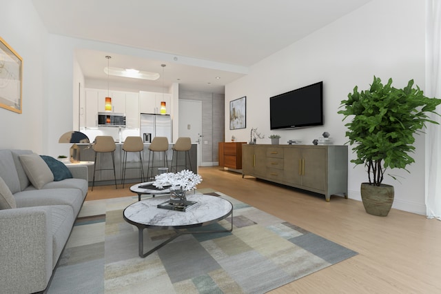 living room featuring light wood-style floors and baseboards