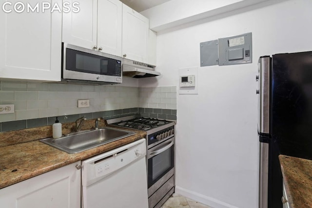 kitchen featuring backsplash, electric panel, sink, appliances with stainless steel finishes, and white cabinets