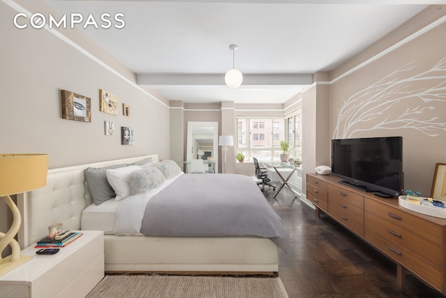 bedroom featuring dark wood-style floors