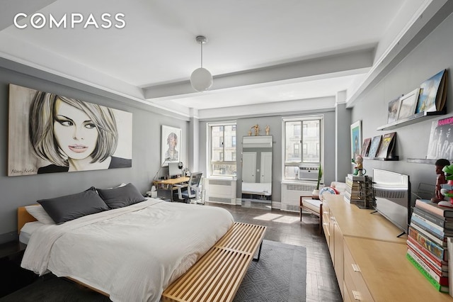 bedroom featuring radiator, cooling unit, beamed ceiling, and baseboards