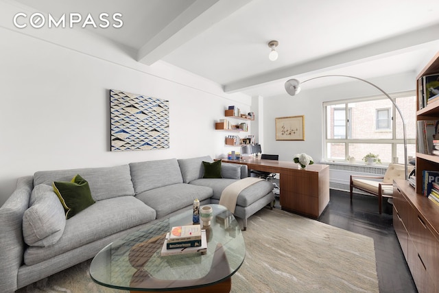 living area with beamed ceiling, dark wood-style flooring, and radiator heating unit