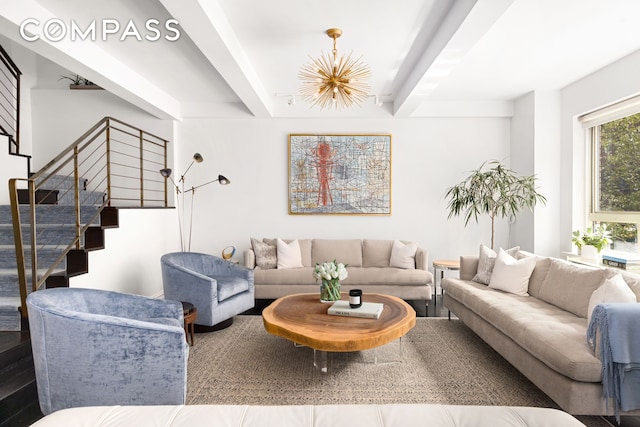 living room with beamed ceiling and stairs