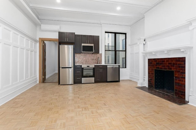 kitchen featuring stainless steel appliances, a brick fireplace, light parquet flooring, beam ceiling, and backsplash