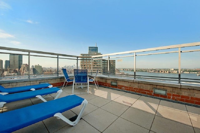 view of patio / terrace featuring a city view and a balcony