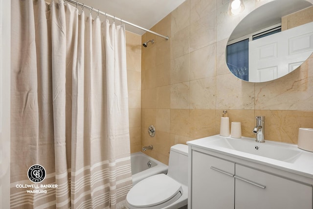 full bathroom with toilet, shower / tub combo, vanity, and tile walls