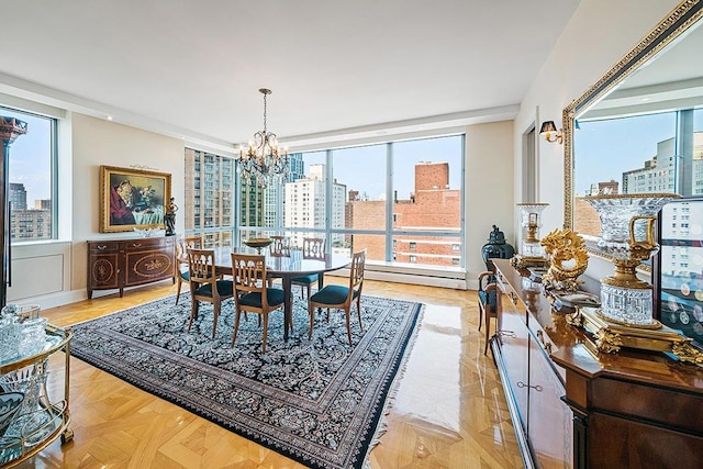 dining area featuring a notable chandelier and a city view