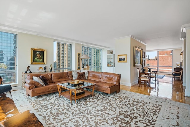 living room featuring ornamental molding, expansive windows, and baseboards