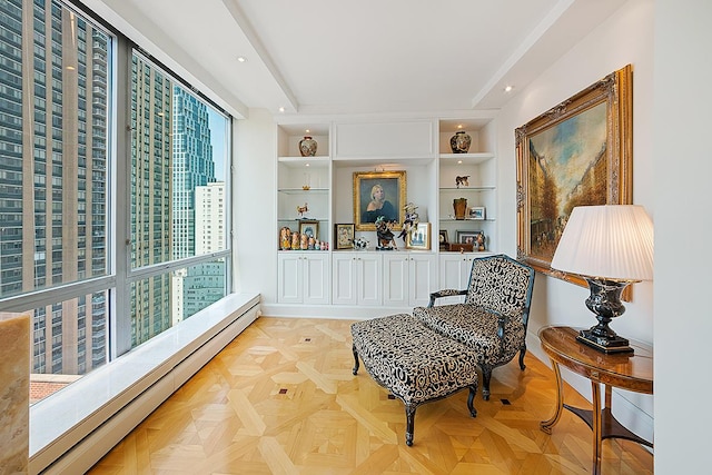 1965 Broadway Unit 26-E, New York City, NY 10023 - living area with a baseboard radiator and built in shelves