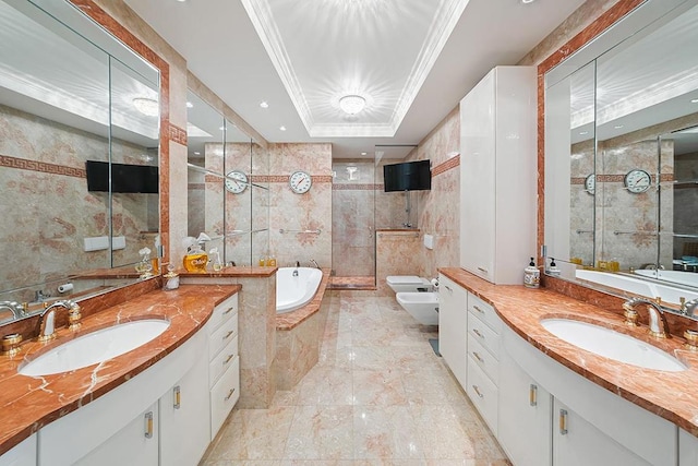 bathroom featuring vanity, tile walls, a bidet, a raised ceiling, and crown molding