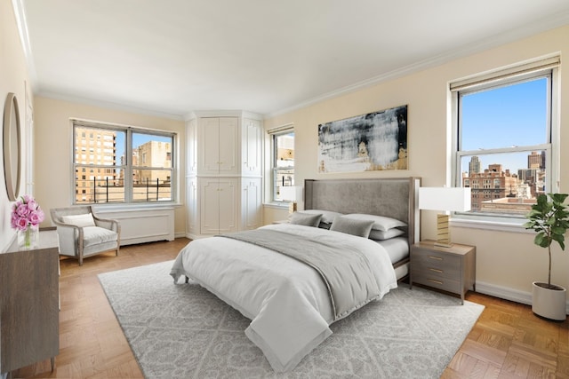 bedroom with ornamental molding, a city view, and multiple windows