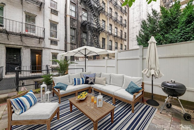 view of patio / terrace featuring an outdoor living space and area for grilling