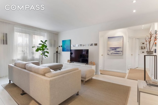 living room with light hardwood / wood-style floors