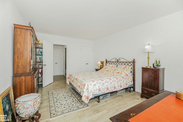 bedroom with hardwood / wood-style flooring