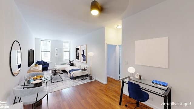 bedroom with ceiling fan and hardwood / wood-style floors