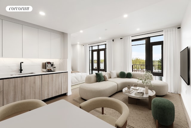 living room with recessed lighting, visible vents, and light wood finished floors