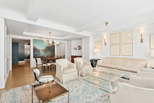 living room with wood-type flooring and a notable chandelier