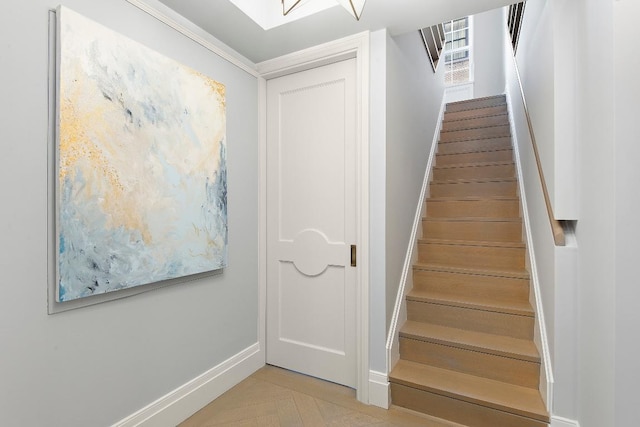 stairs featuring ornamental molding