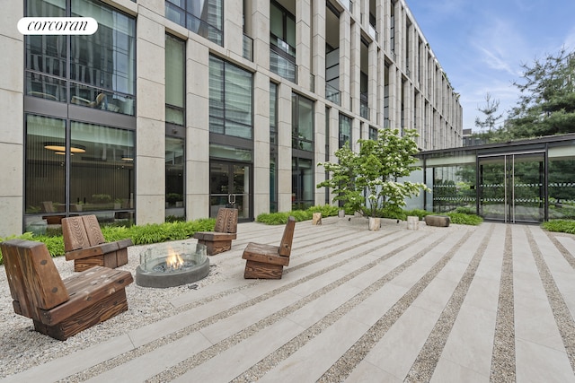 101 Warren St Unit 2620, New York City, NY 10007 - view of patio featuring a fire pit