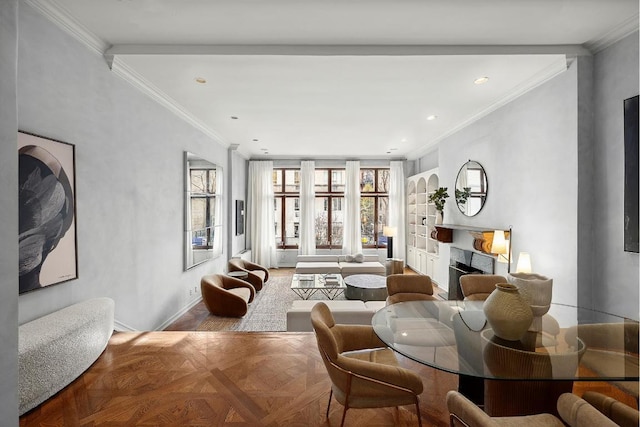 dining area featuring light parquet flooring, crown molding, a high end fireplace, and built in shelves