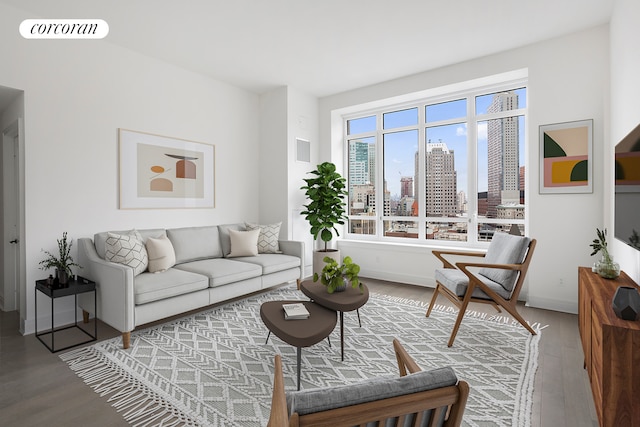 living room with a view of city, wood finished floors, and visible vents