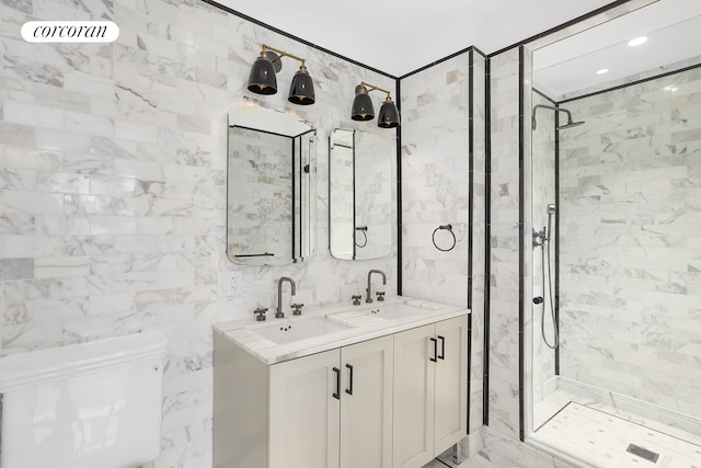 full bath featuring a shower stall, toilet, and a sink