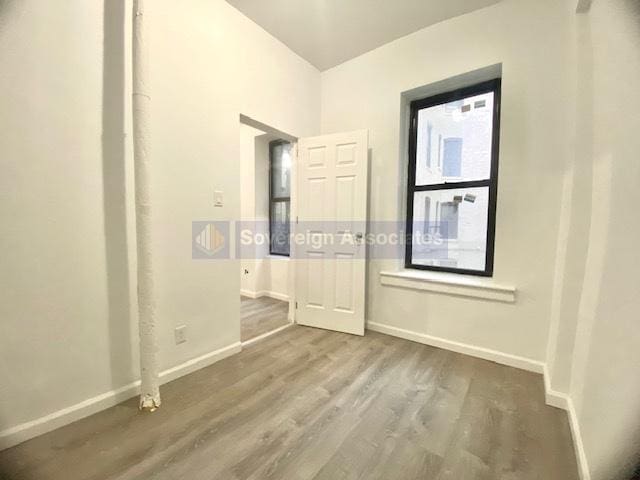 unfurnished room featuring wood-type flooring