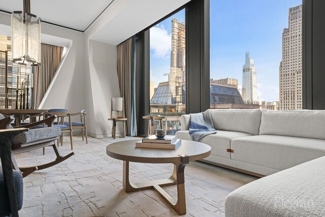 living room with floor to ceiling windows and plenty of natural light