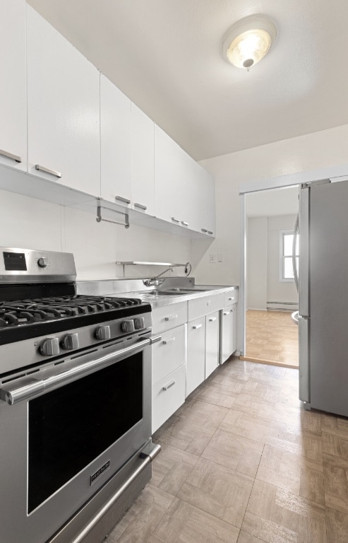 kitchen featuring sink, white cabinetry, and appliances with stainless steel finishes