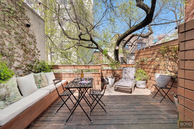 wooden deck featuring outdoor lounge area