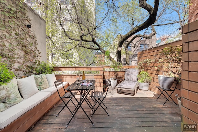 deck featuring outdoor lounge area