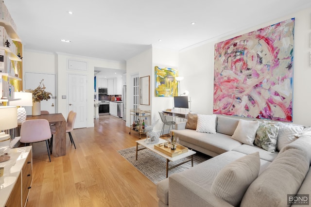 living area with recessed lighting, light wood-type flooring, and crown molding