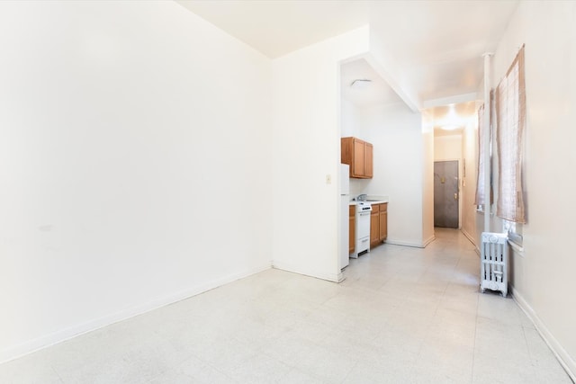 interior space featuring light floors and baseboards