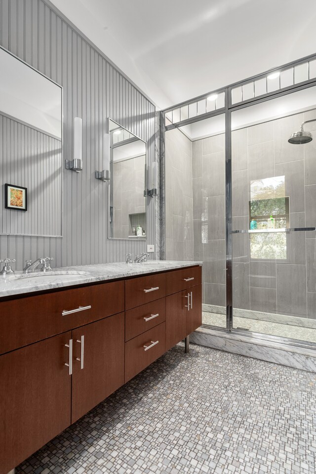 entrance foyer with rail lighting, hardwood / wood-style floors, and a notable chandelier