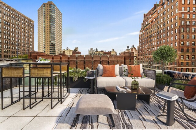 view of patio featuring a city view and an outdoor hangout area