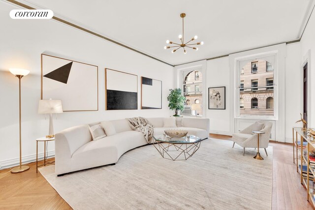 living room featuring visible vents and a notable chandelier