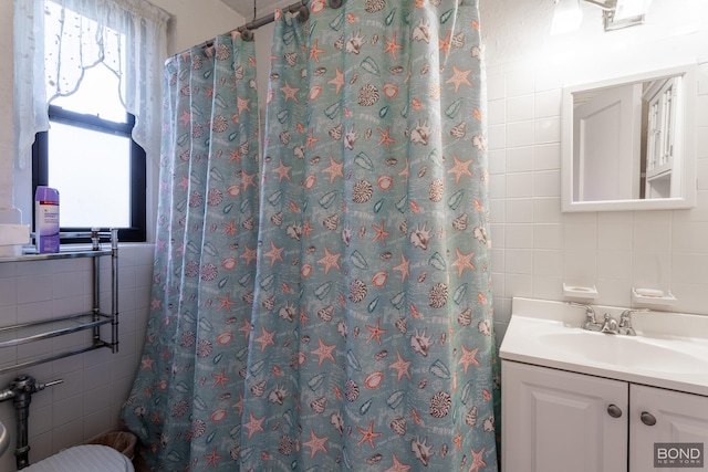3321 Bruckner Blvd Unit 1J, New York City, NY 10461 - bathroom featuring backsplash, tile walls, curtained shower, and vanity