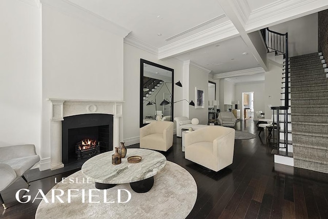 living room featuring ornamental molding, dark hardwood / wood-style floors, and beamed ceiling