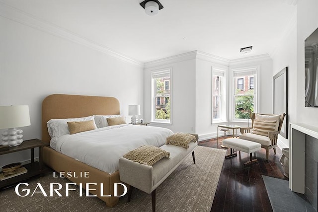 bedroom featuring crown molding and dark wood-type flooring