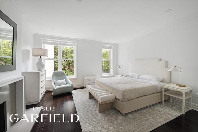 bedroom featuring dark hardwood / wood-style flooring and crown molding