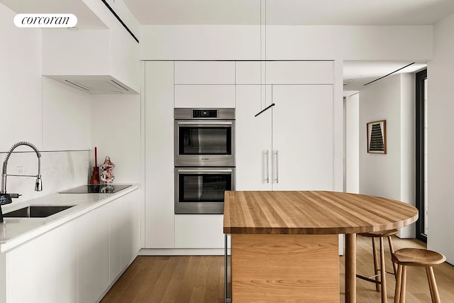 9 Chapel St Phb, Phb, New York City, NY 11201 - kitchen featuring a sink, modern cabinets, wood finished floors, double oven, and white cabinets