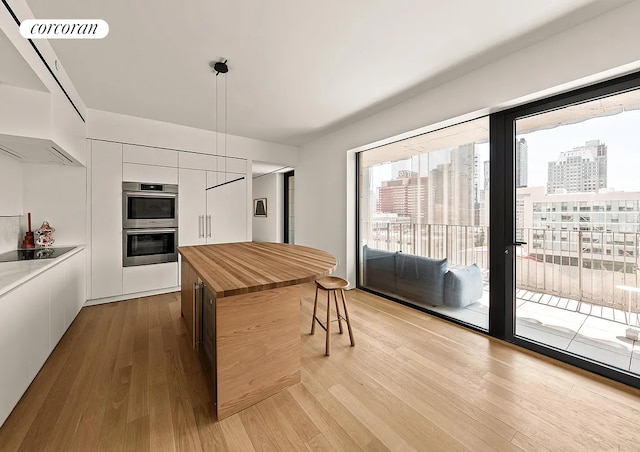 9 Chapel St Phb, Phb, New York City, NY 11201 - kitchen with wooden counters, modern cabinets, double oven, white cabinets, and light wood-style floors