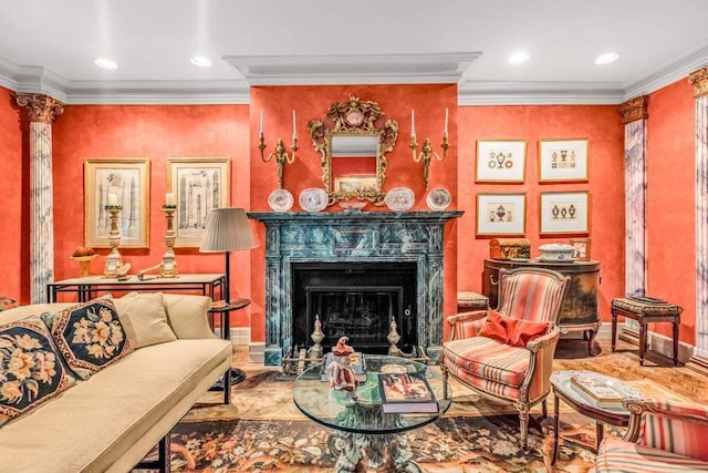 living room featuring ornamental molding and ornate columns