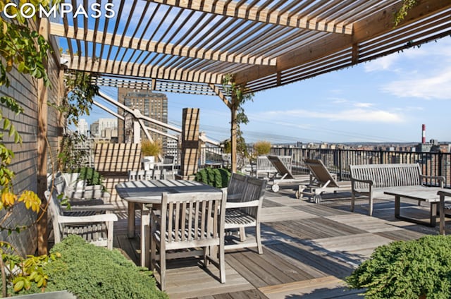 wooden deck featuring a pergola